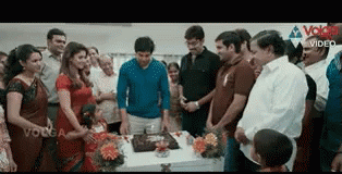 an older image shows people waiting for the cake to cut it