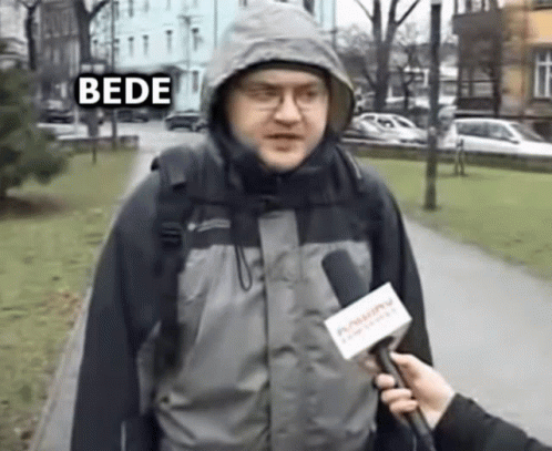 person holding a news camera and speaking to someone outside in winter coat