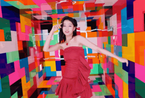 woman standing in multi - colored room looking at camera