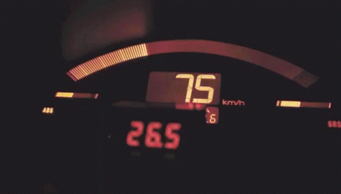 closeup of a digital dashboard, with the speed going under 250