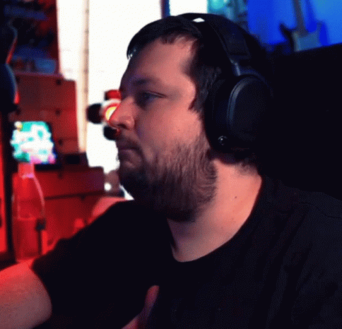 a man in headphones at a computer desk