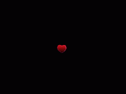 two hearts are lit on a black background