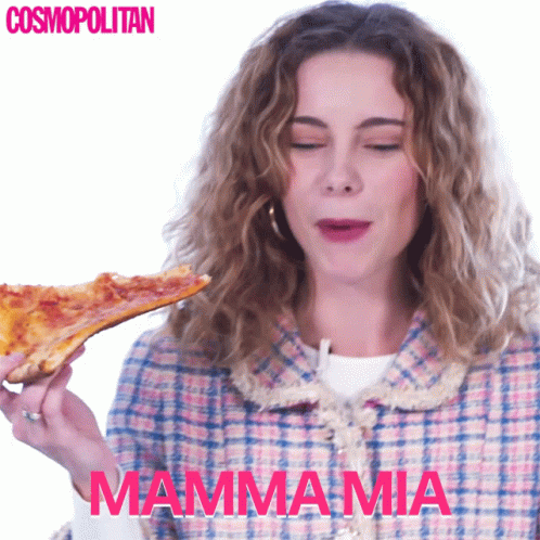 a girl that is holding a slice of pizza