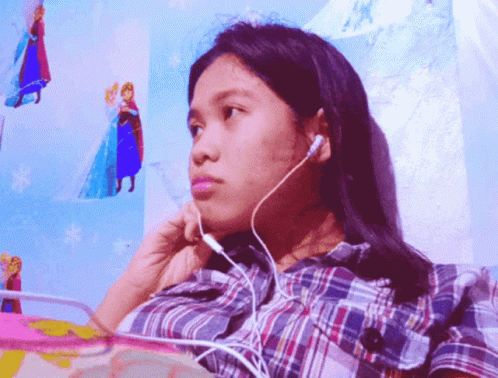 a young person wearing earphones listening to music