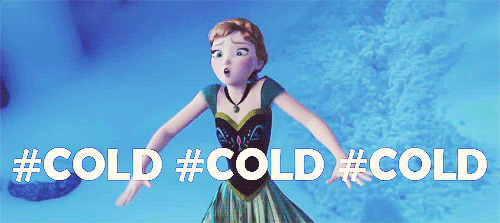 a woman wearing an image of a frozen world figure that reads, cold cold cold