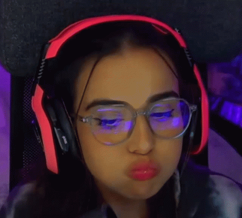 a close up of a person wearing glasses and headphones