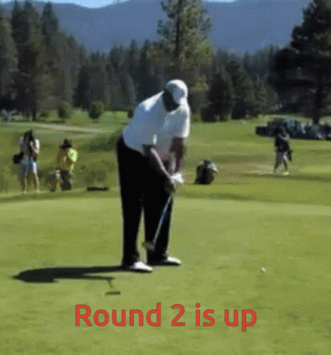 a man taking a swing at a golf ball