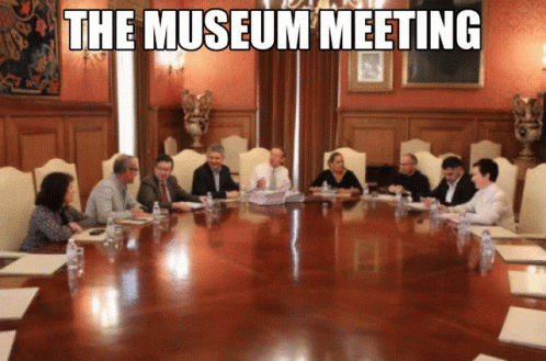 an image of people sitting around a conference table with the words, the museum meeting