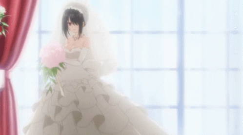 a person is standing in a wedding dress and the dress has purple flowers