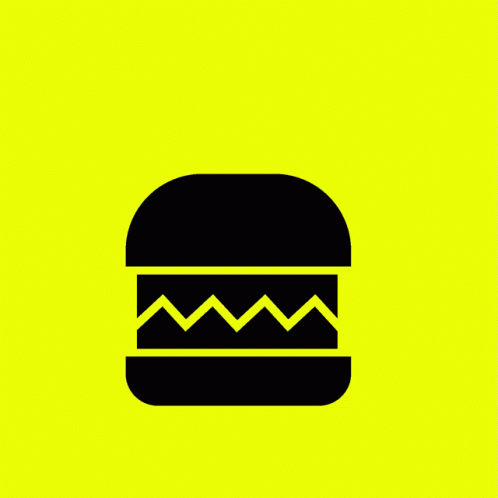 a black and green hamburger sitting on top of a green background