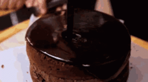 there is a round cake with a knife in it