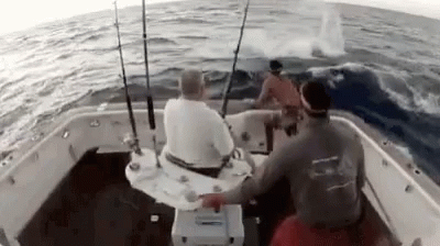 two men who are on a boat fishing
