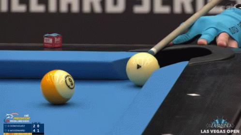 a pool table with some balls on it and one on the side