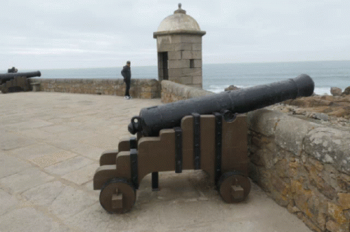 an old cannon that is sitting on the wall
