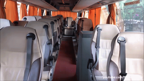 inside of a bus showing many empty seats