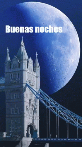 a large pink moon is near a tower bridge