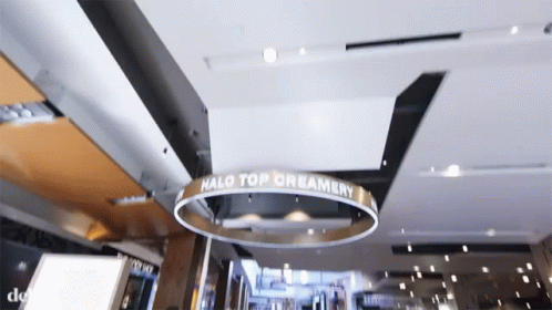 a po of a ceiling with a sign hanging from the ceiling