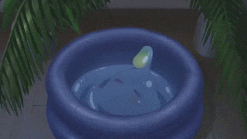 a large pot with a green liquid and a little bit of water in it