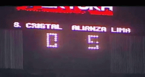 a large electronic scoreboard at night in the stadium