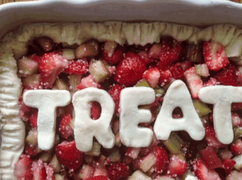 a tray full of food that reads treat in different letters