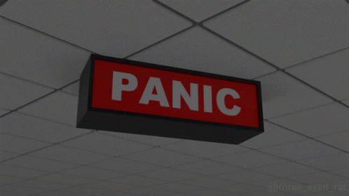 a blue sign mounted on the ceiling reads panic
