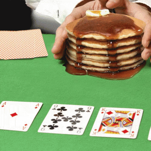 a table with playing cards and playing cards