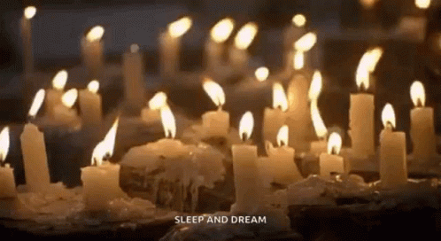 a group of blue lit candles with words sleep and dream