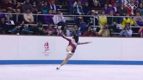 this is a person on an ice rink in front of an audience
