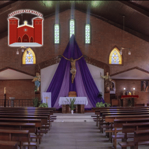 the inside of a church with pews and banners on the ceiling