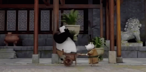 a panda bear is leaning over a large vase