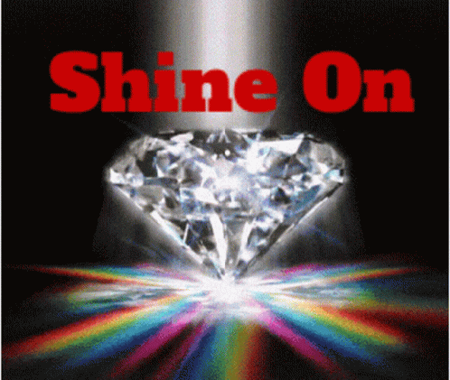 a white diamond with bright colored rays shining around