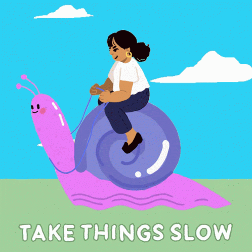 a  riding on top of a pink snail