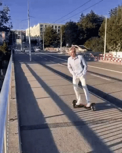 a skate boarder rides a long ramp