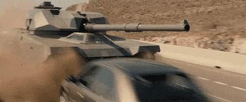 a t - 60 light tank speeding down a road