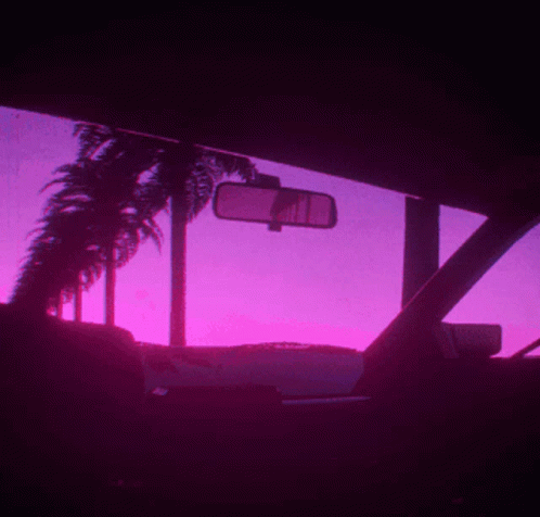 silhouettes of a car and palm trees on a pink background