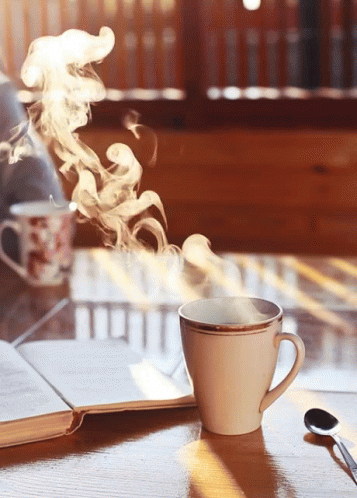 white smoke floating over a gray cup on a saucer