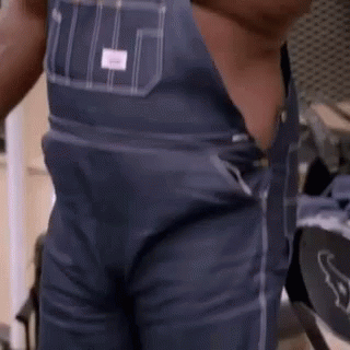 a close up of the waist of a man wearing overalls