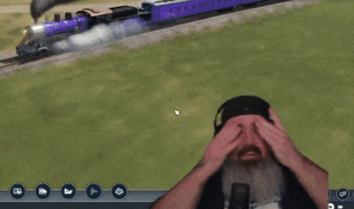 a man on a video game console playing a train simulator