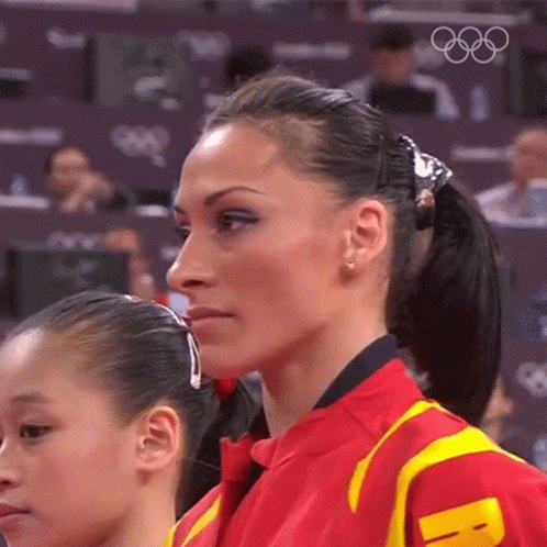 the two olympic athletes are wearing ear clips