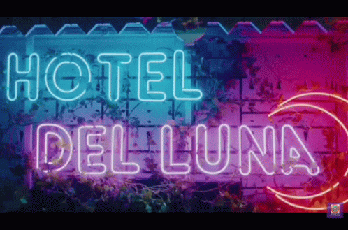 neon signage for the el del luna in a night time scene