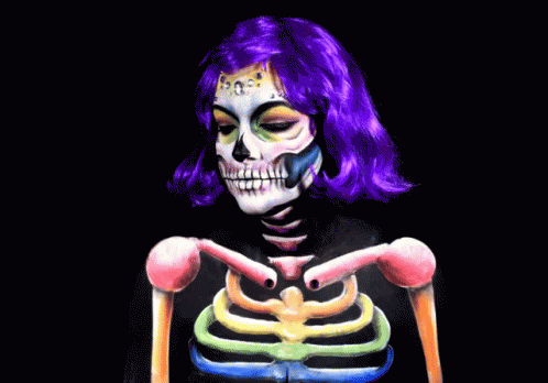 a skully woman with pink hair holding a skeleton