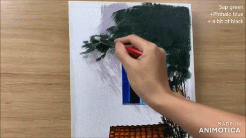 a person painting a wall with a brush and color