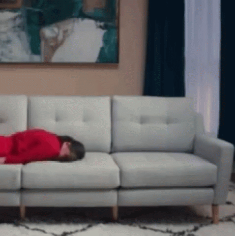 woman sleeping on the couch in her living room