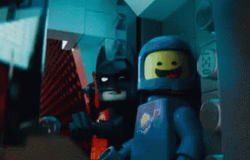the lego batman and mr meme are staring at each other