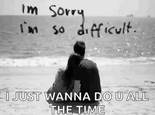 two people are sitting on the beach together and a message on it says i am sorry in so difficult