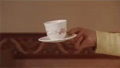 an image of a person holding a cup