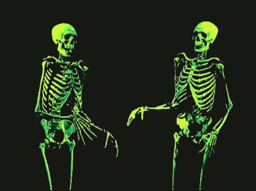 two skeleton models are sitting in green neons