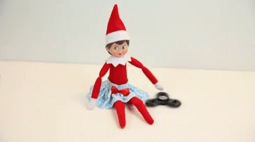 an image of a toy elf sitting on a table
