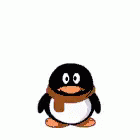 a small penguin wearing a scarf sitting down