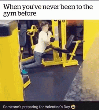 a woman in white shirt doing some exercises with machine